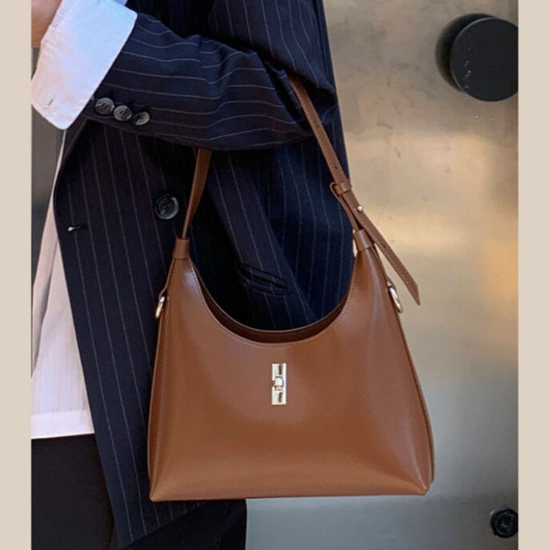 Genuine Leather Lock Single Shoulder Tote Bag In Brawn color lifestyle