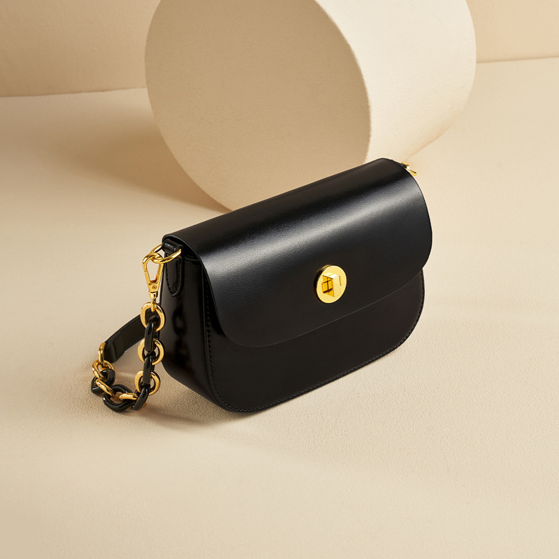 Women’s Vintage Minimalist Genuine Leather Lock Chain Crossbody Shoulder Bag in black color from the side