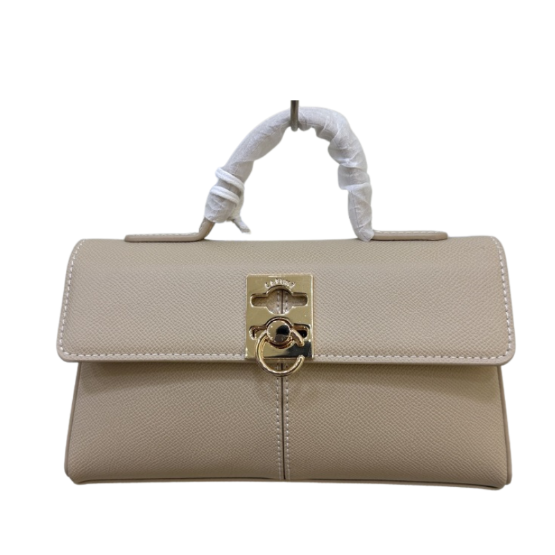 beige leather top handle bag with flap closure and clean structured look