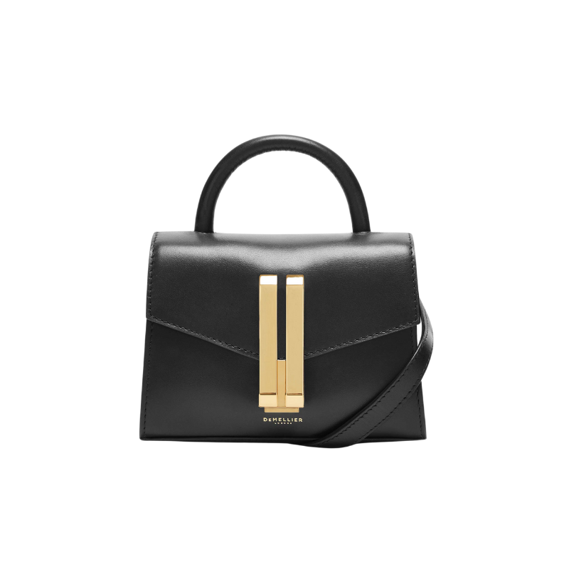 black leather baguette bag with top handle and gold closure