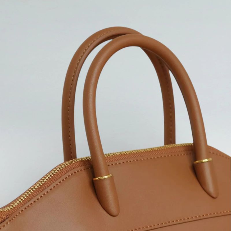 structured leather tote bag handle stitching detail close-up