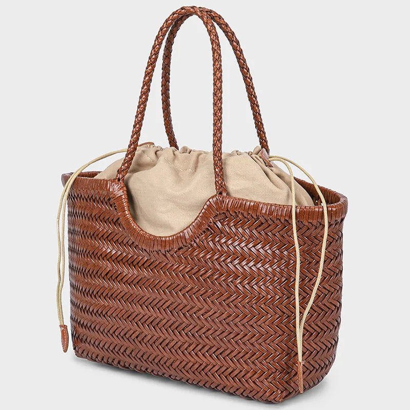 Angled view of brown woven leather tote bag
