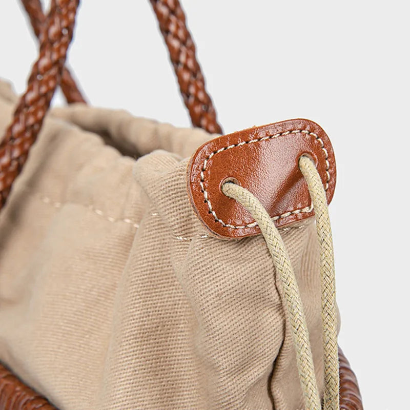 Drawstring pouch detail inside woven leather tote bag