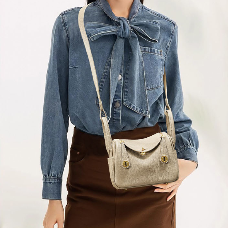 Genuine Leather Cat Eye Decorated Crossbody Shoulder Handbag held by model