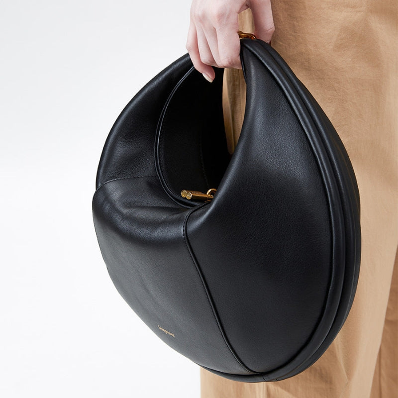 Genuine Leather Large Half Moon Bag black color lifestyle model handling it