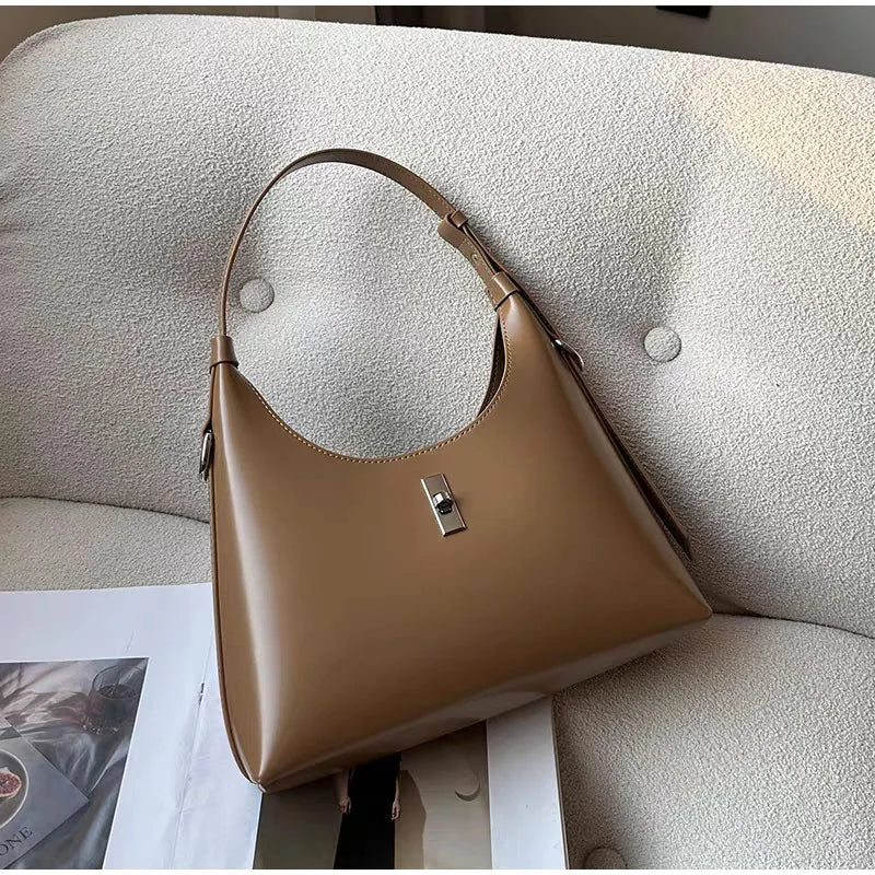 Genuine Leather Lock Single Shoulder Tote Bag In Brawn color life style