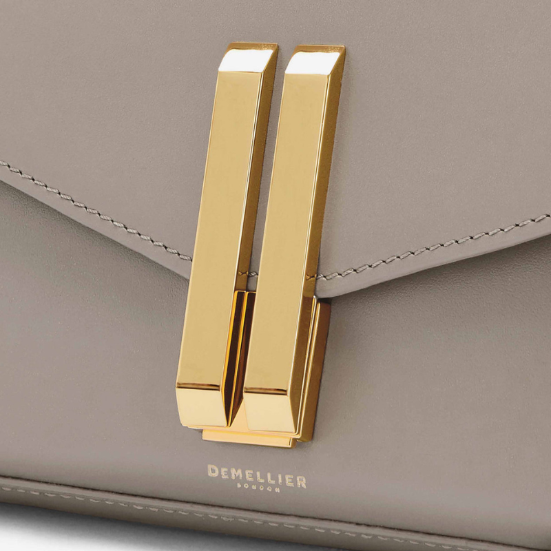 Genuine Leather Magnetic Clasp Crossbody Baguette Bags taupe color showing the logo