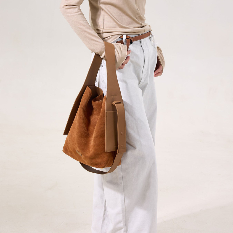 Genuine Leather Shoulder Bucket Bag Caramel color held by model