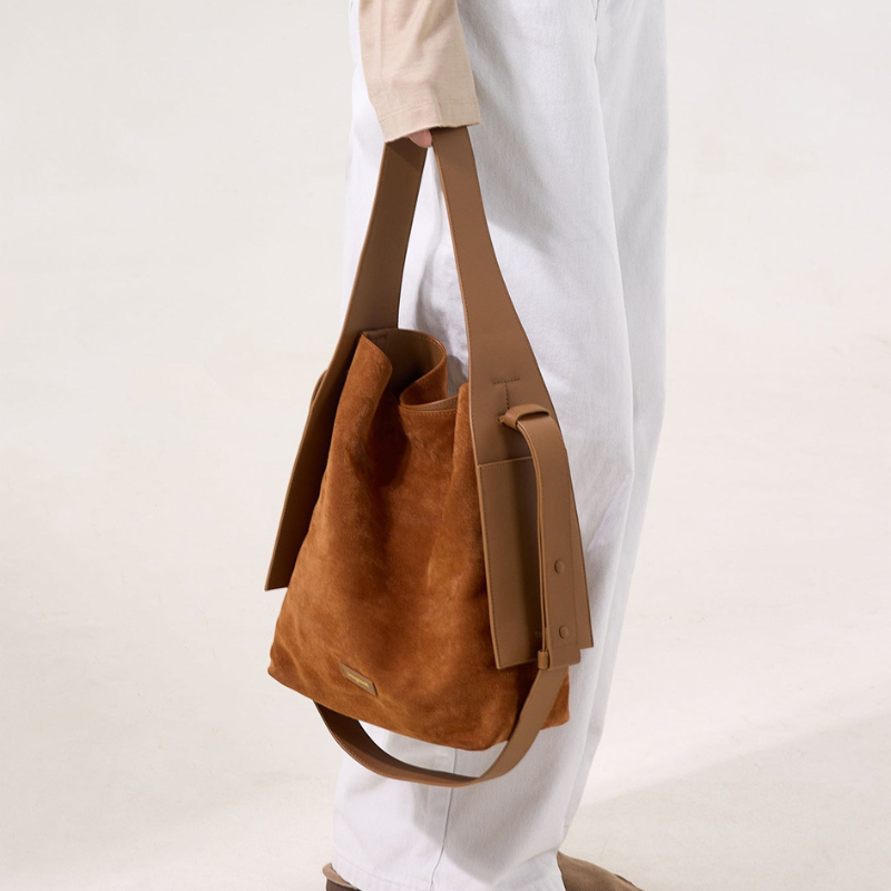 Genuine Leather Shoulder Bucket Bag Caramel color held by model as tote bag