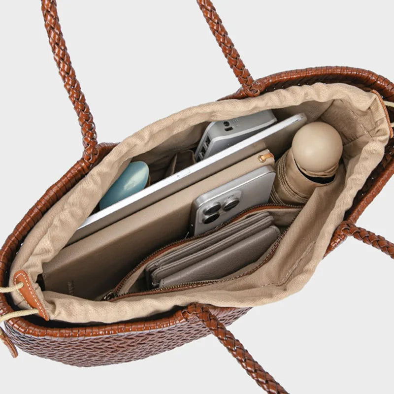 Inside view of woven leather tote bag with organized storage