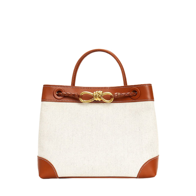 Leather canvas top handle bag with gold hardware front view
