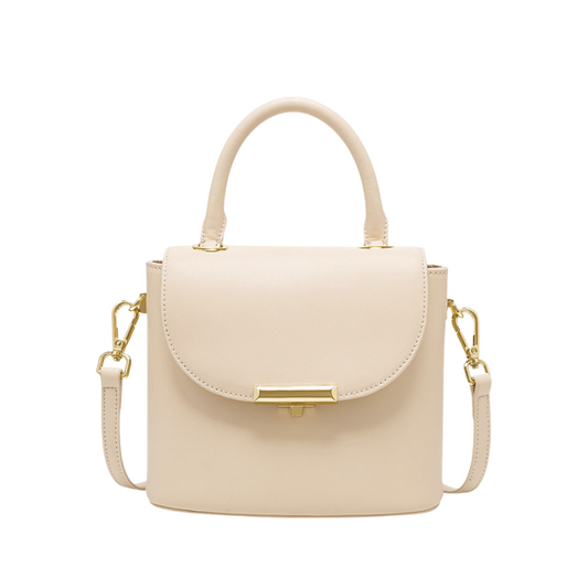 Lock buckle handbag in milk white genuine leather with top handle and crossbody strap