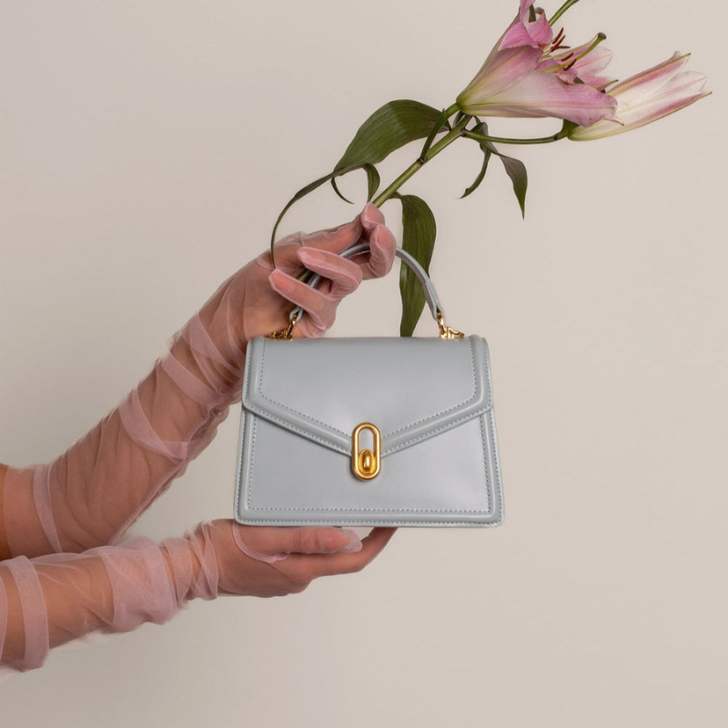 Minimalist Genuine Leather Magnetic Closure Crossbody Shoulder Top Handle Bag ivory color lifestyle 2