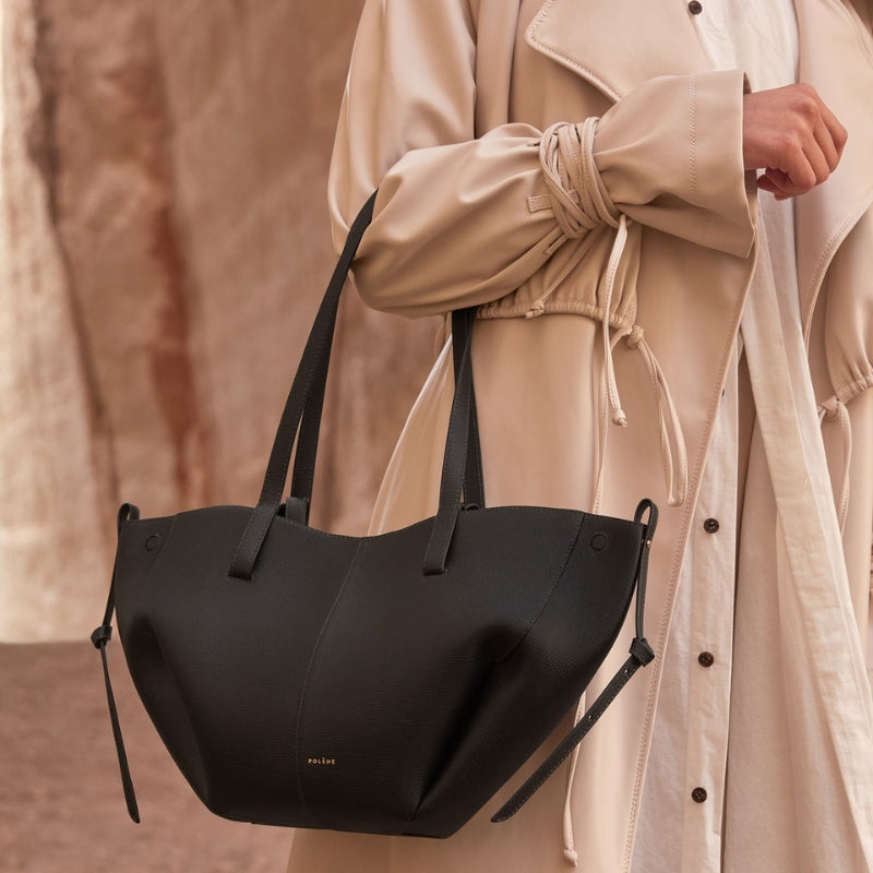Soft leather tote bag styled with neutral outfit for daily wear