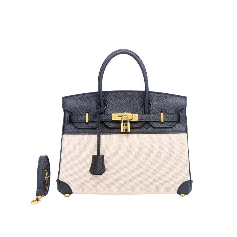 Structured leather canvas top handle bag in black with gold-tone hardware