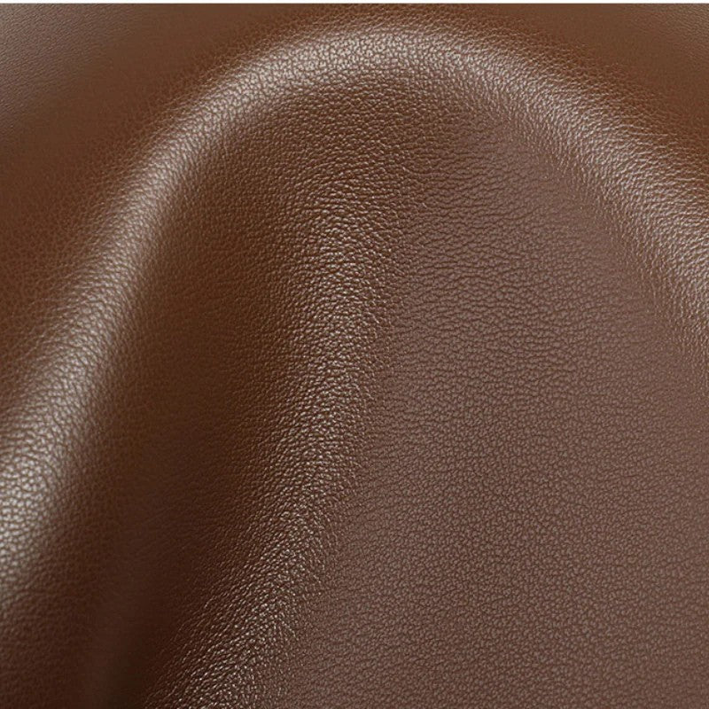 Women’s Genuine Leather Buckle Closure Shoulder Bucket Bag in coffee color showing details of the leather