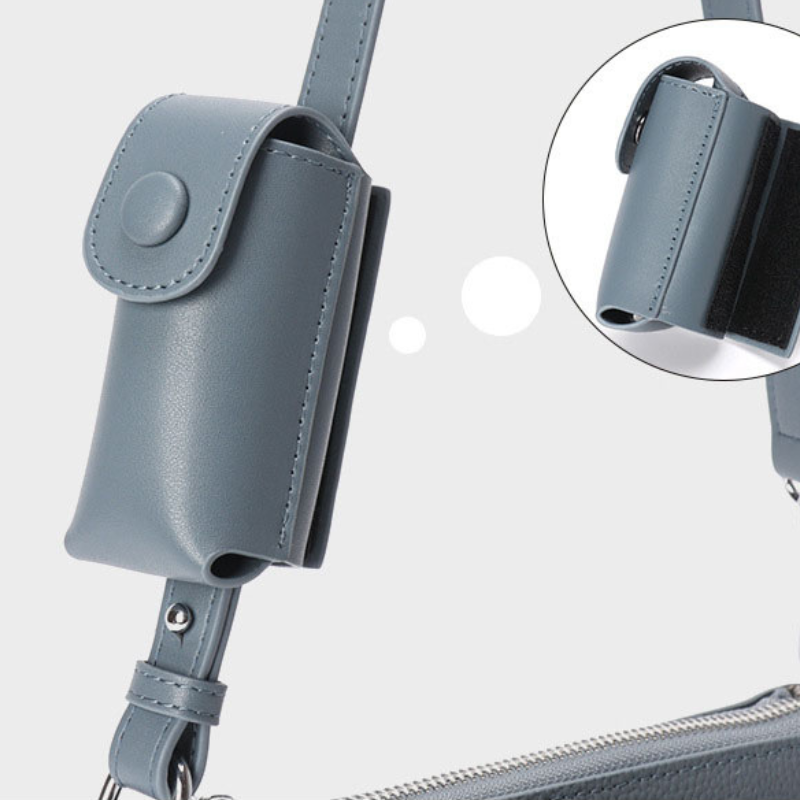 Women’s Genuine Leather Decorative Buckle Zipper Crossbody Baguette Bag in mint blue color showing details of the strap