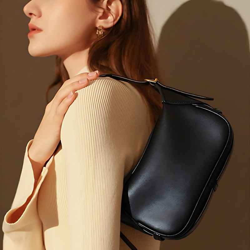 Women’s Genuine Leather Dumpling-Shaped Shoulder Bag in black color lifestyle model wearing it as a shoulder bag