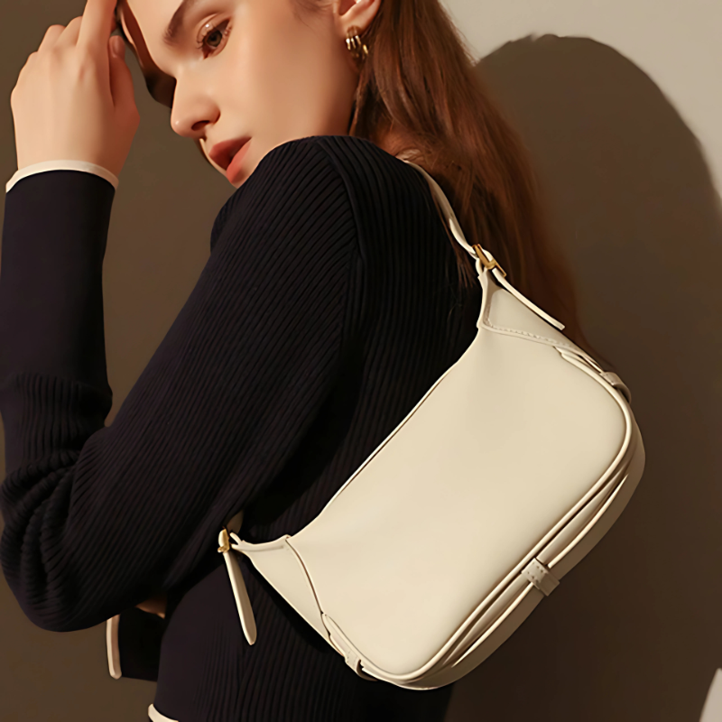 Women’s Genuine Leather Dumpling-Shaped Shoulder Bag in chalk white color lifestyle model wearing it as a shoulder bag