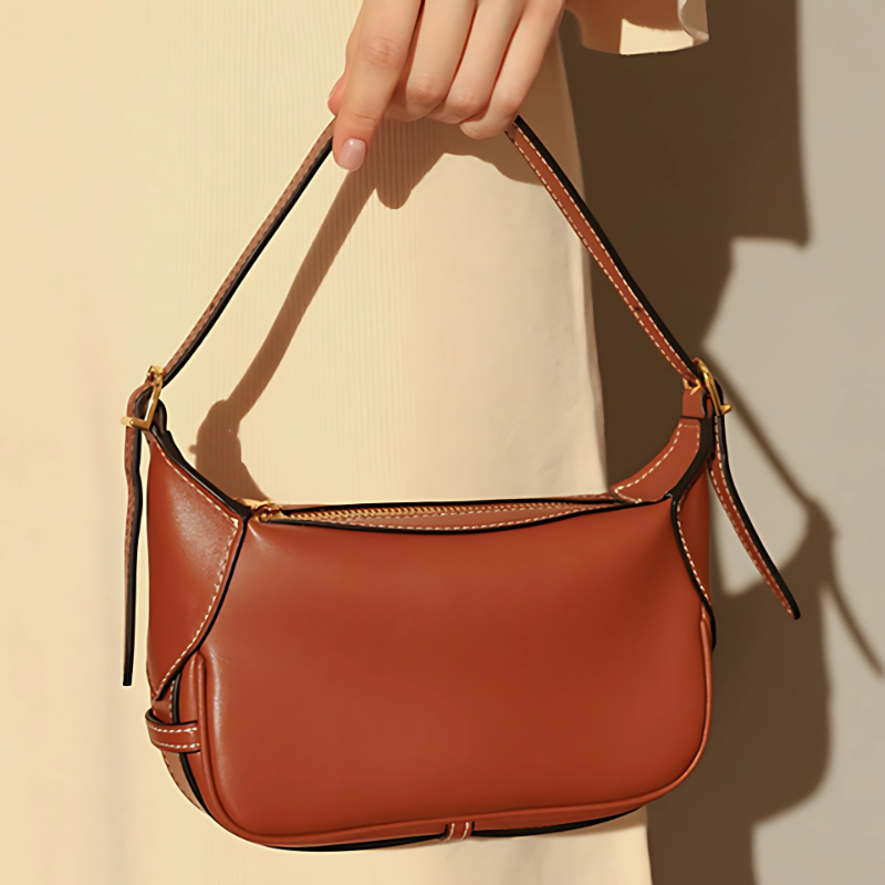 Women’s Genuine Leather Dumpling-Shaped Shoulder Bag in golden brown color lifestyle model showing it as a top handle bag