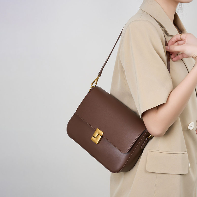 Women’s Genuine Leather Magnetic Closure Crossbody Shoulder Baguette Bags In Vintage in coffee color lifestyle model wearing it as a shoulder bag
