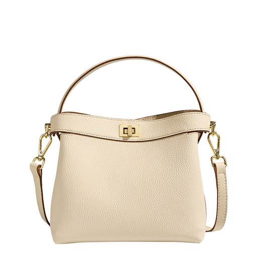 Women’s Genuine Leather Minimalist Lock Clasp Shoulder Bucket Bag in creamy white color from the front
