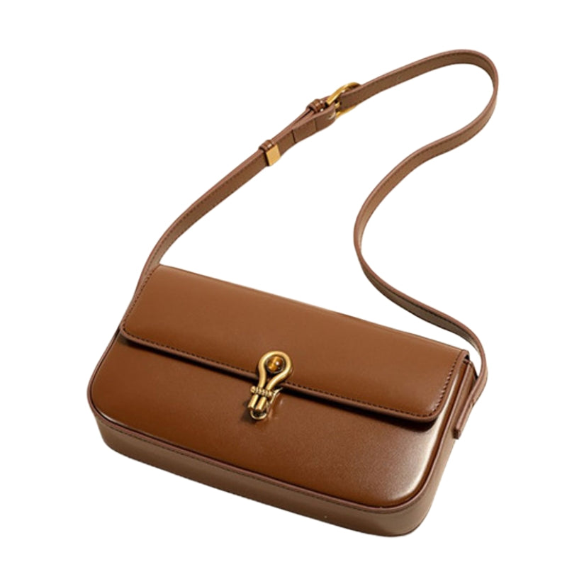 Women’s Genuine Leather Shoulder Baguette Bag with Gold-Tone Hardware in camel color from the front showing lifestyle of the bag