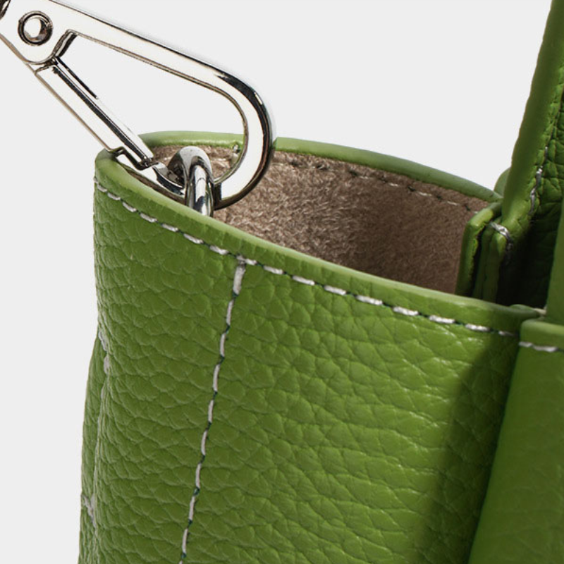 Women’s Mini Genuine Leather Minimalist Yuanbao-Shaped Tote Bag in avocado color showing details of the bag