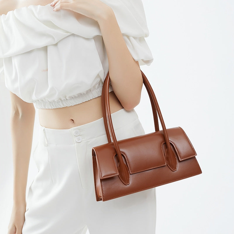 Women’s Minimalism Flap Baguette Bags in Genuine Leather in Cognac color model carry it as a tote bag