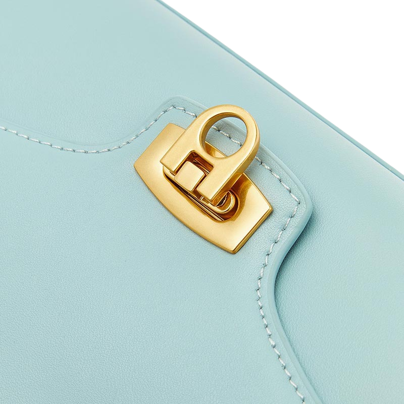 Women’s Minimalist Genuine Leather Shoulder Baguette Bag with Lock Closure in sky blue color showing details of the bag