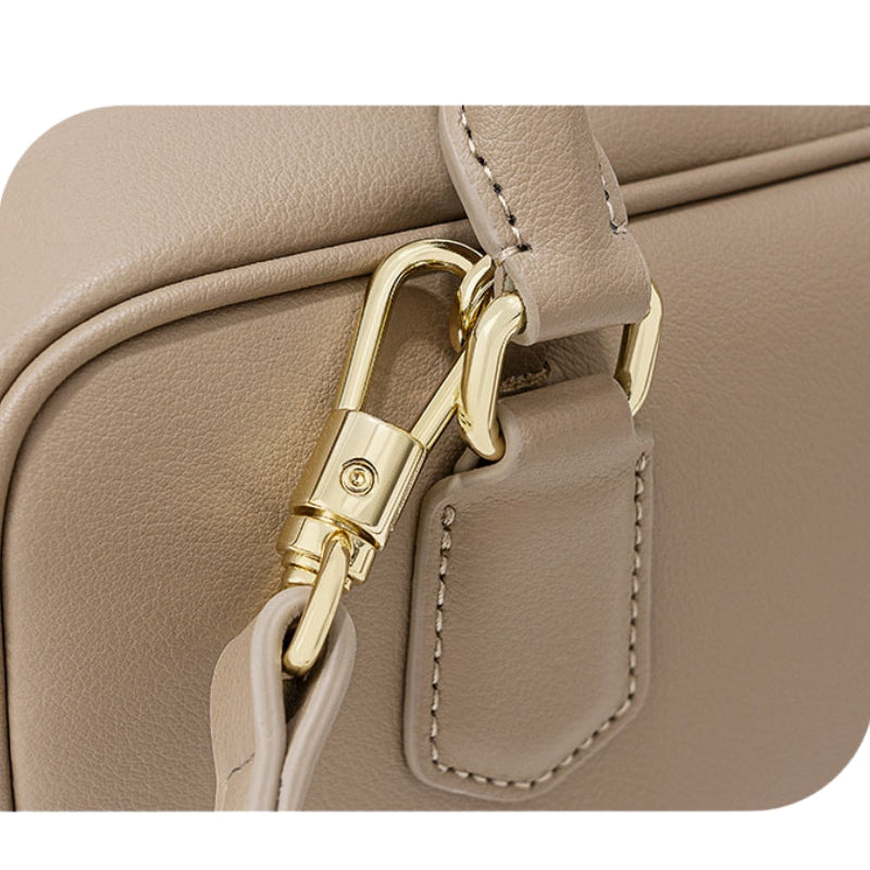 Women’s Minimalist Genuine Leather Zip Closure Boston Handbag in milk apricot color showing details of the bag