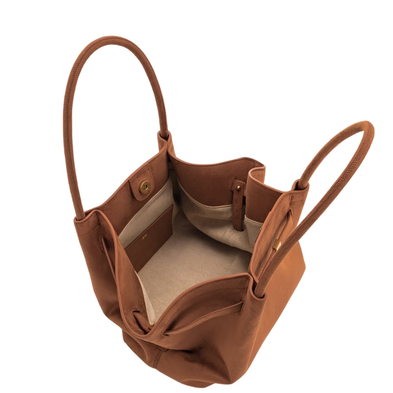 Women’s Suede Leather Dumpling-Shaped Small Tote Bag in Cognac color showing inside the bag
