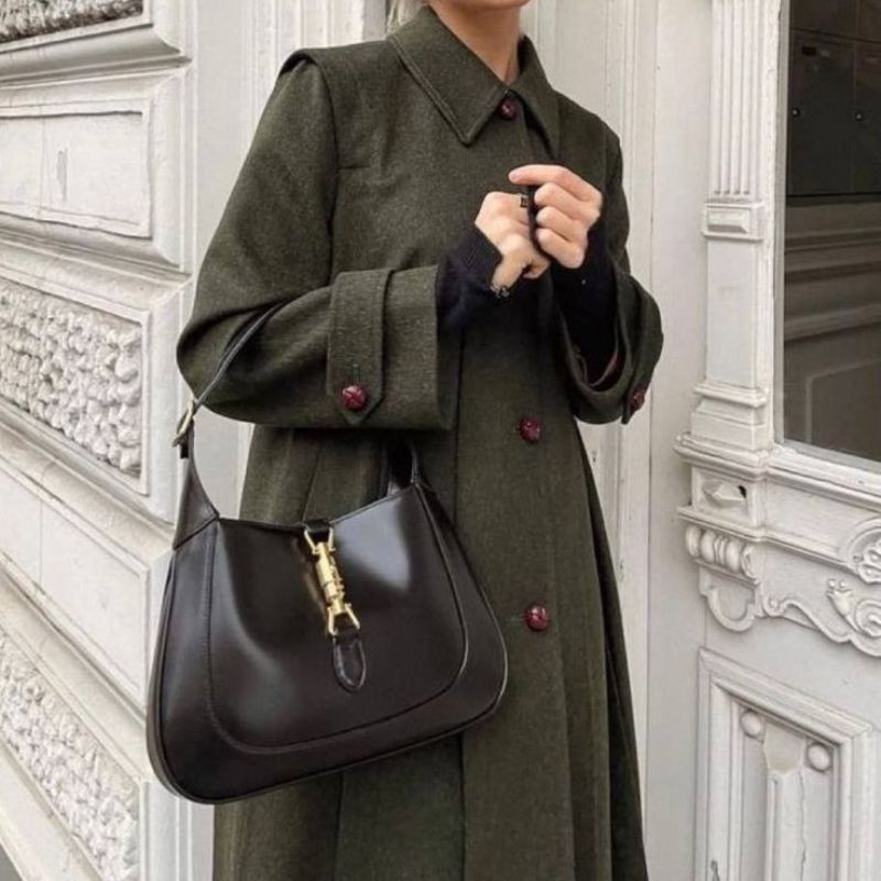 Women’s Vintage Genuine Leather Lock Buckle Saddle Shoulder Tote Bag in Black color lifestyle