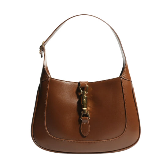 Women’s Vintage Genuine Leather Lock Buckle Saddle Shoulder Tote Bag in cognac color from front