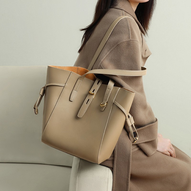 Women’s Vintage Large Genuine Leather Lock-Clasp Tote Bag in Taupe color lifestyle model wearing it as a crossbody  bag
