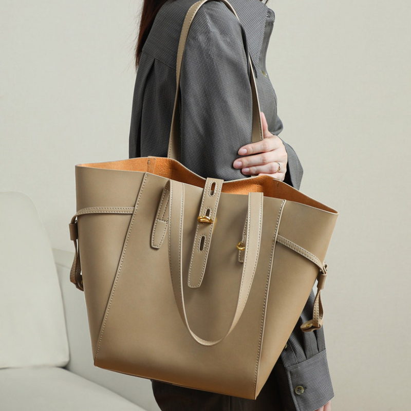 Women’s Vintage Large Genuine Leather Lock-Clasp Tote Bag in Taupe color lifestyle model wearing it as a shoulder bag