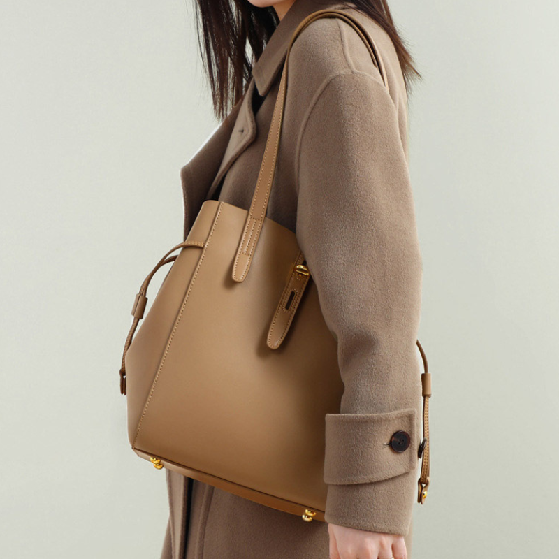 Women’s Vintage Large Genuine Leather Lock-Clasp Tote Bag in brown color lifestyle model wearing it as a shoulder bag