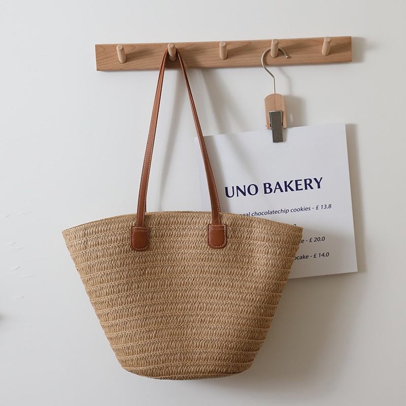 Women’s Woven Straw Beach Tote Bag with Large Capacity in dark sand color  lifestyle from the front