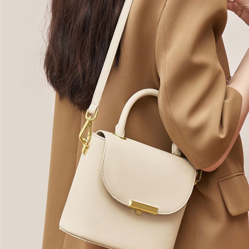 Women's milk white lock buckle handbag worn as a crossbody bag