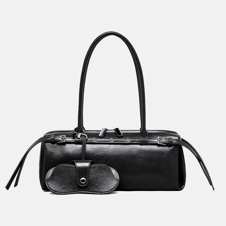 A black leather handbag with a structured cylindrical shape, dual top handles, a front flap pocket, and silver-tone hardware, shown against a light gray background.