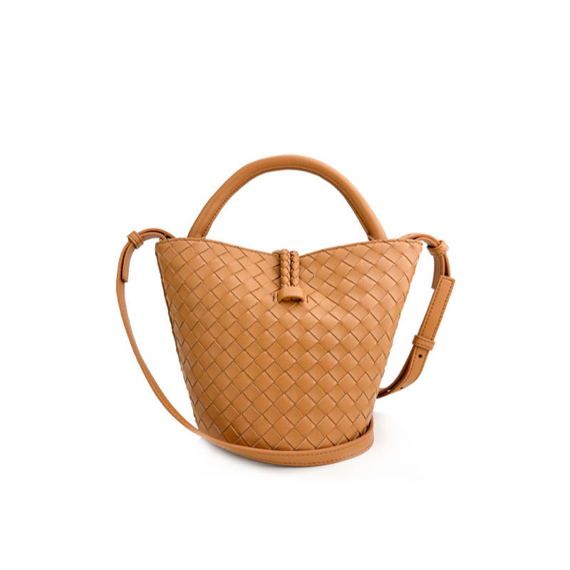 Woven leather bucket bag in camel — close-up of woven texture and knot closure