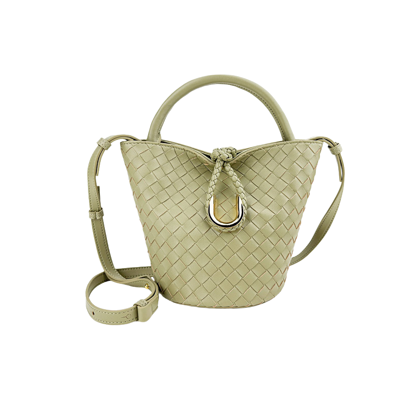 Woven leather bucket bag in light green — front view