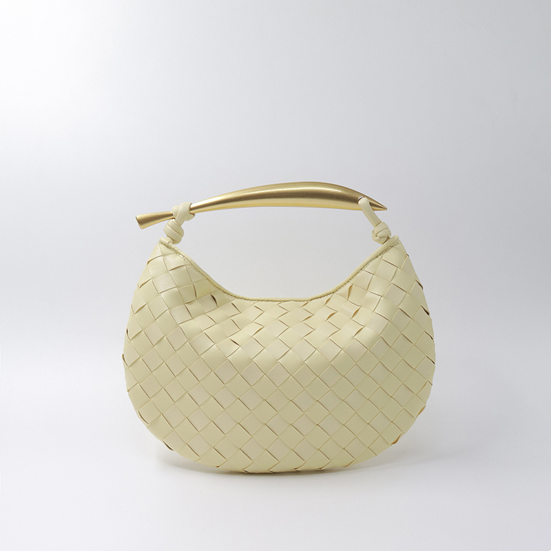 Woven leather half-moon bag in pale yellow with gold handle