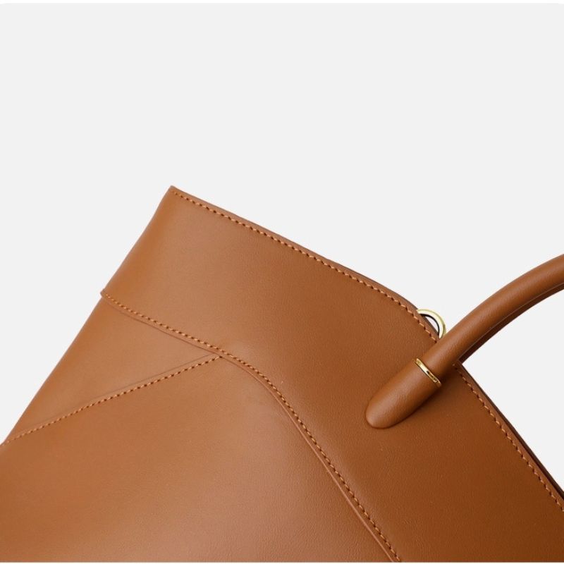large leather tote bag close-up texture detail smooth finish