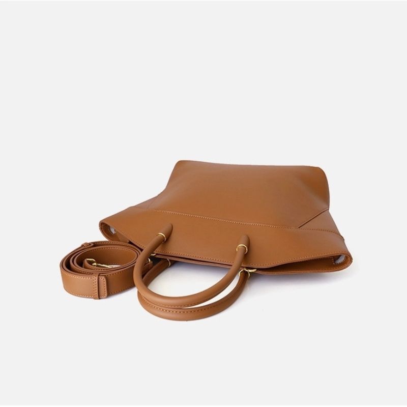 large leather tote bag side angle structured silhouette