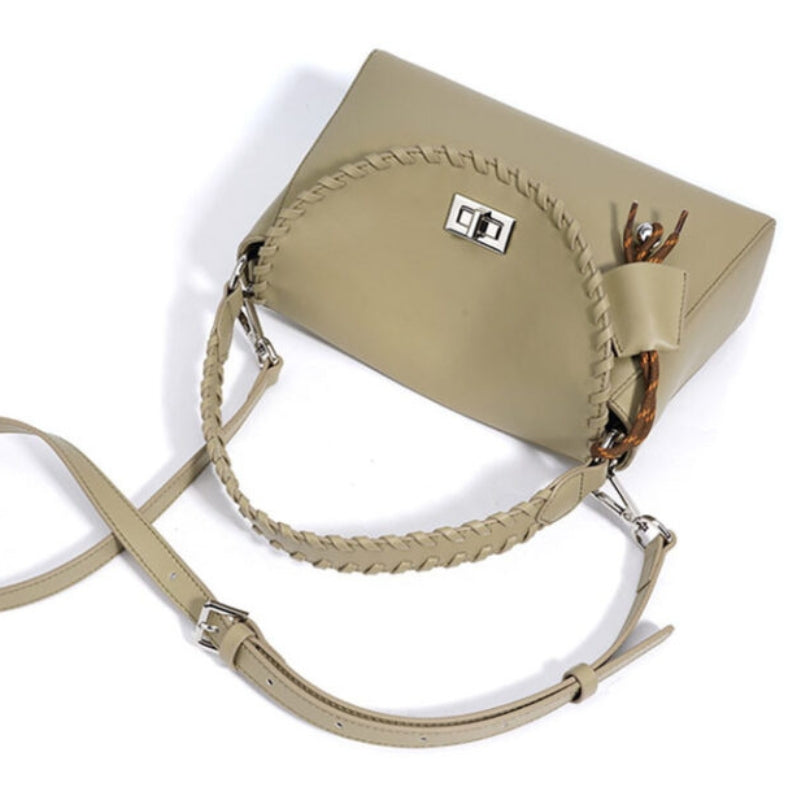 leather bag with braided handle and shoulder strap minimalist structured design