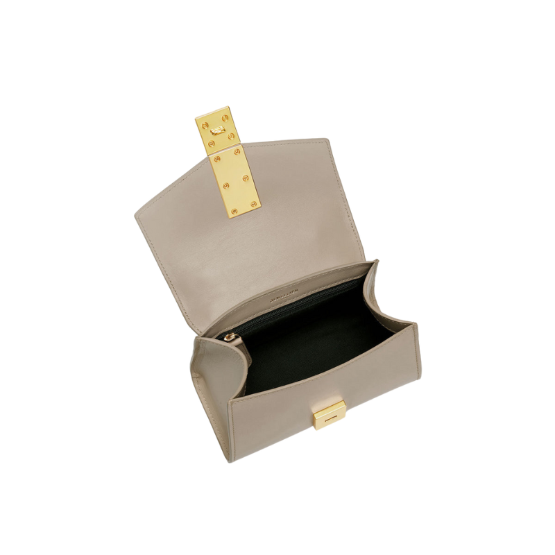 leather baguette bag interior view with magnetic clasp opening