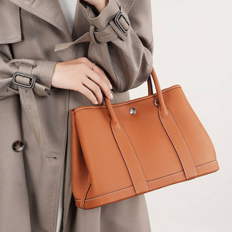 leather tote bag with crossbody strap for women carried for work