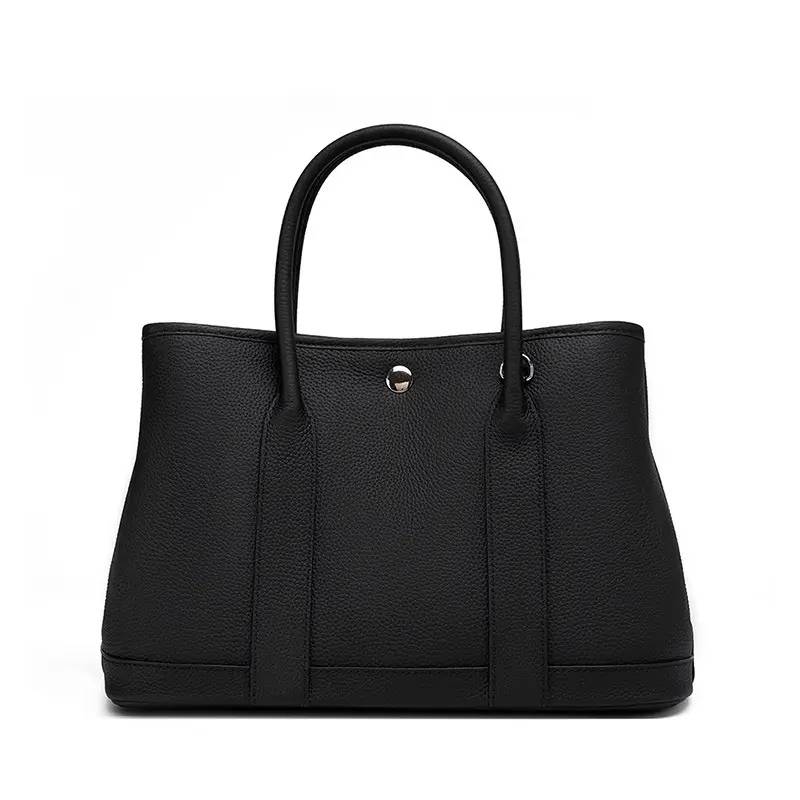 leather tote bag with crossbody strap for women in black color