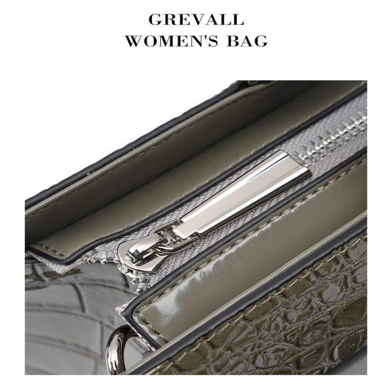 lock buckle closure detail structured leather handbag hardware close up